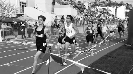 Distance runners from various schools, including LBHS, compete against each other. 