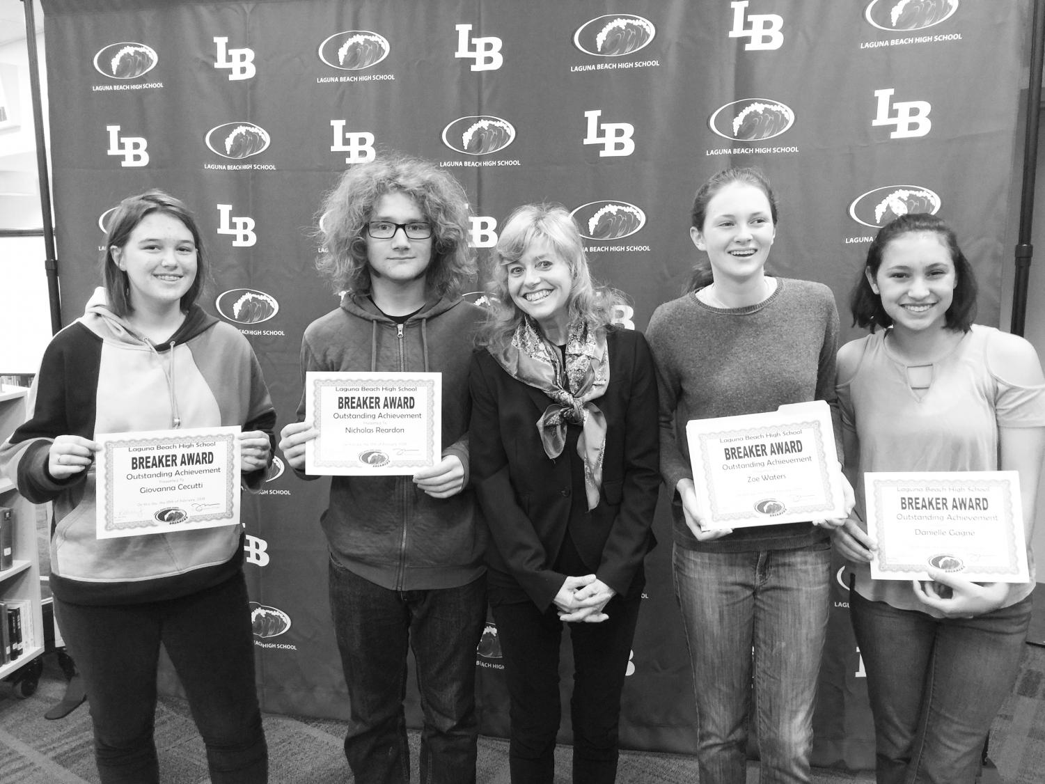 (Left) Giovanna Cecutti, Nick Reardon, Zoe Waters, and Danielle Gagne celebrate their successes in French in both Madame Randi Beckley’s and Madame Odile Dewar’s French classes. (Right) Izzy Saunders receives a Breaker Award from her Global Studies teacher Jennifer Lundblad. Teachers and students related how appreciative they were that the new awards format felt more personal and meaningful than the previous structure.