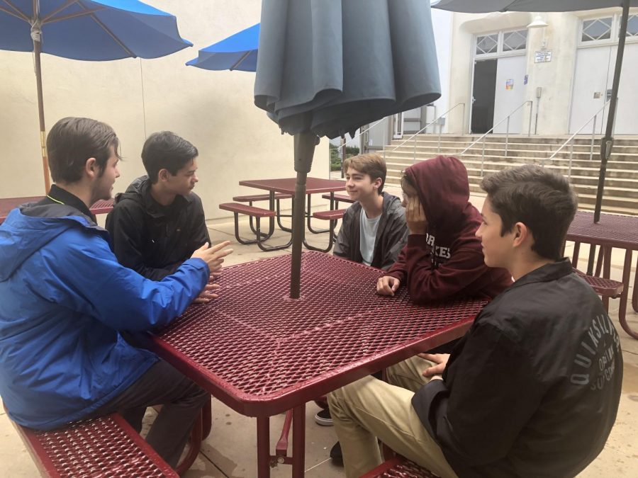 Vincent, in blue on left, enjoying his time with friends. 