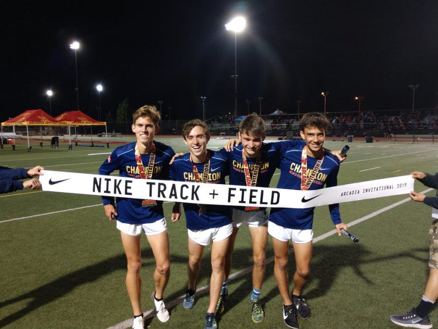 The 4x1600 team,(left to right) Sebastian Fisher, Ryan Smithers, Logan Brooks, and Mateo Bianchi celebrate their incredible performance at the Arcadia  Invitational on April 6,2019. They currently have the best time in the nation for the 4xmile.