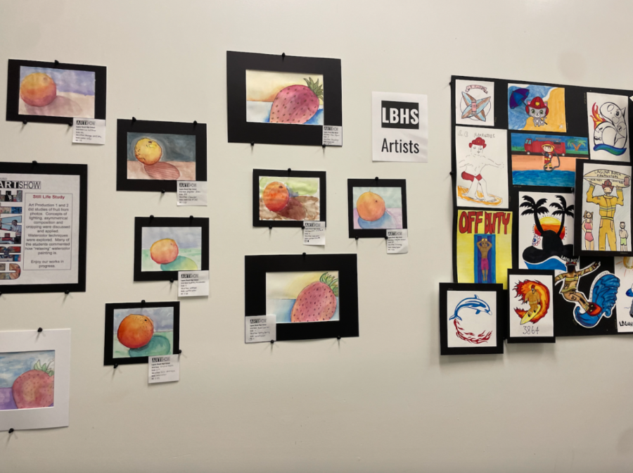 Student artwork in the 30s hallways. On the right, are student submissions for firefighter t-shirt proposals created by Art Production 1 and 2. 