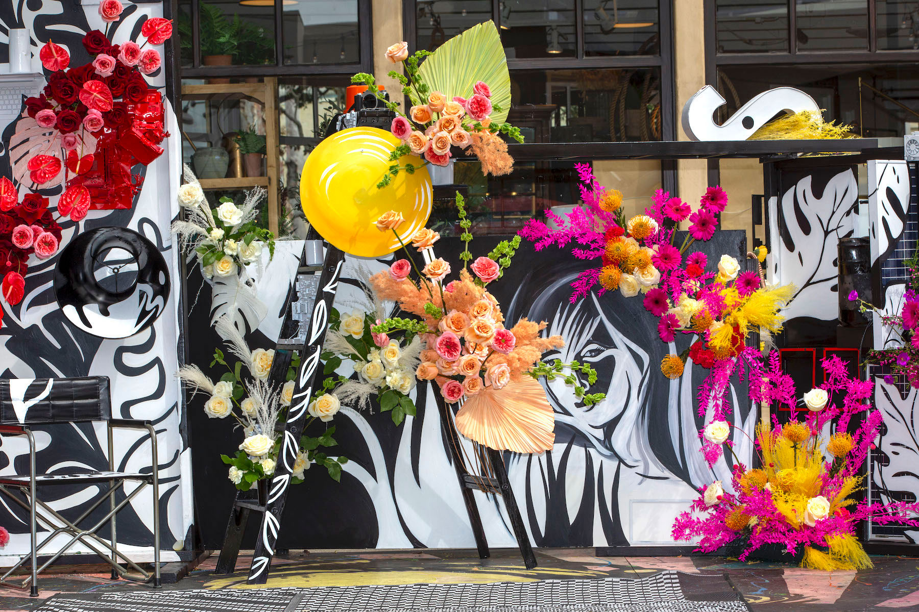 The student-designed floral pop-up mural in Downtown Laguna combined fresh florals with found objects